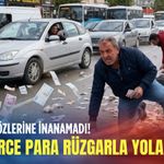Görenler gözlerine inanamadı! Destelerce para rüzgarla yola saçıldı
